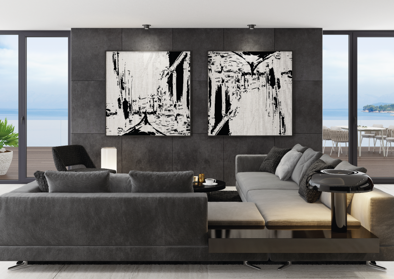 large art pieces hanging on a dark wall