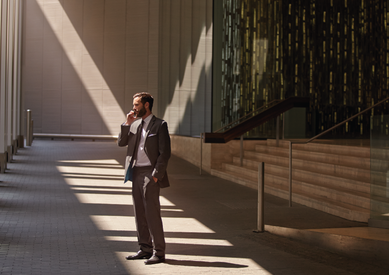 Beam of light shines on a man in a large room